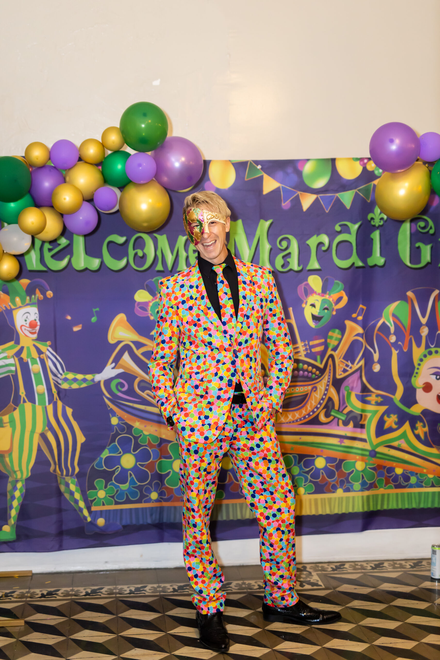 Man dressed in a colorful suit and mask
