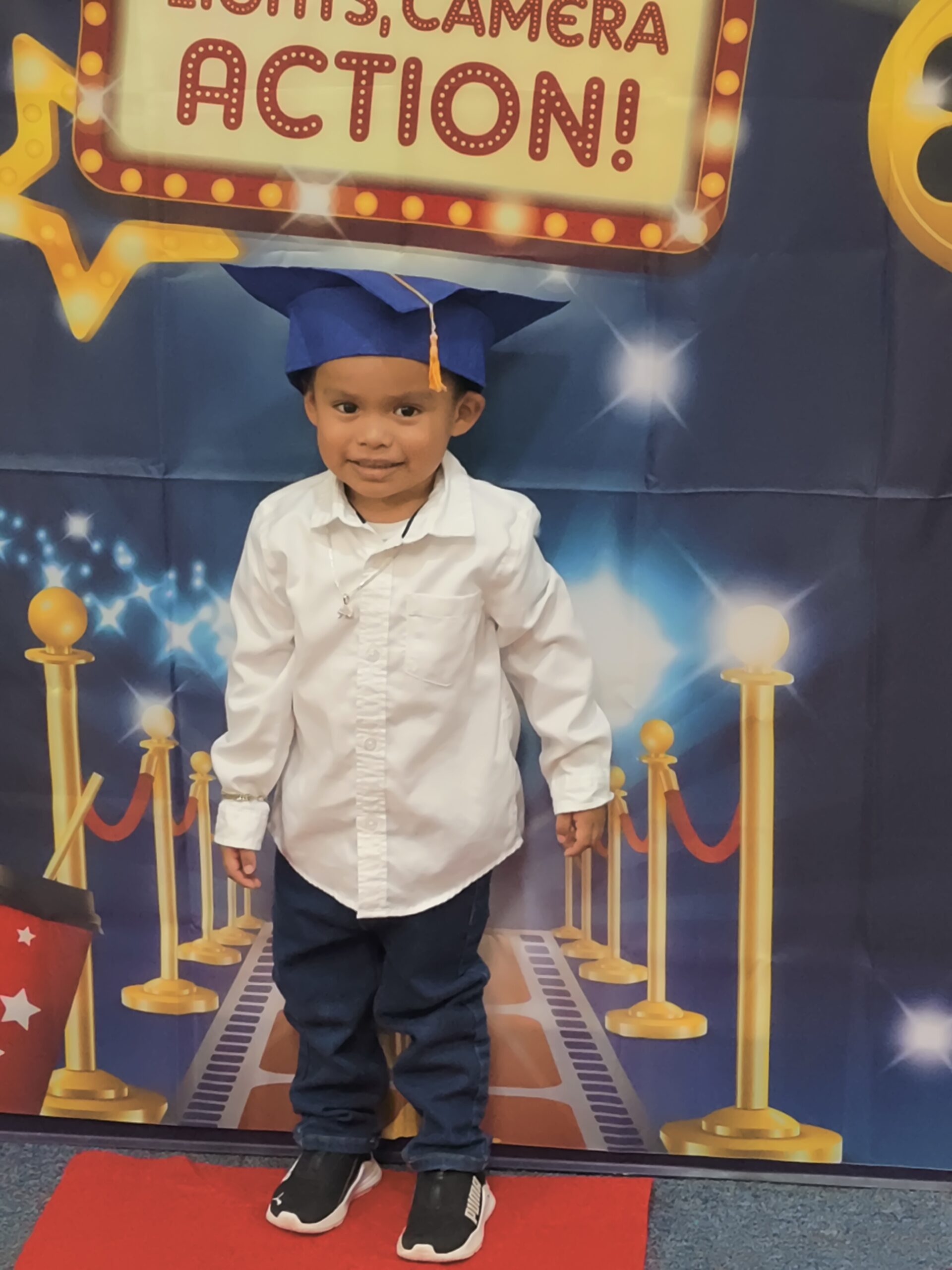 young boy in graduation cap
