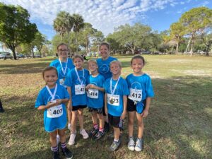 group of children in blue 5K fun run shirts