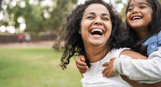 Mom and daughter laughing